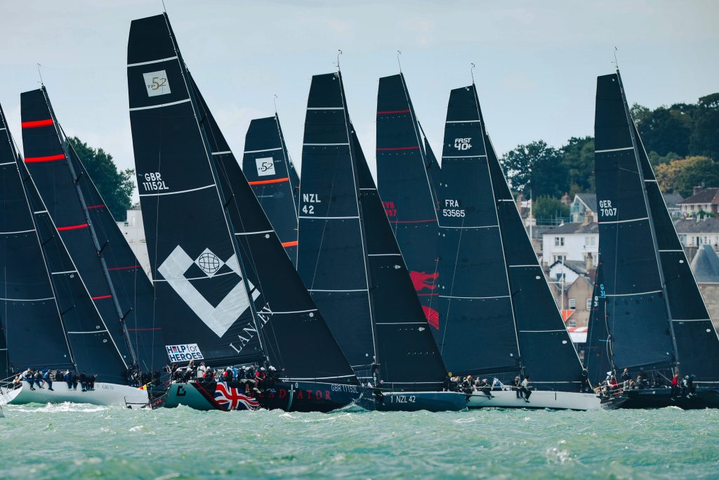 TP52s and other IRC Class Zero yachts crossing the start line together for the Britannia Cup at North Sails Cowes Week